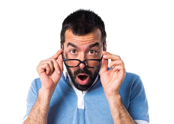 Man with blue shirt doing surprised gesture — Stock Photo, Image