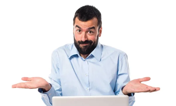 Man with laptop making unimportant gesture — Stock Photo, Image