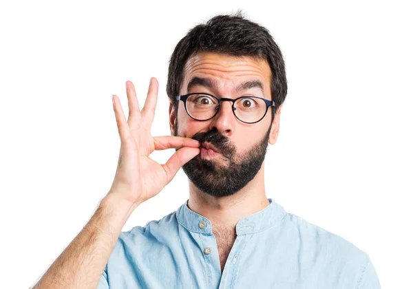 Bonito homem fazendo gesto de silêncio — Fotografia de Stock