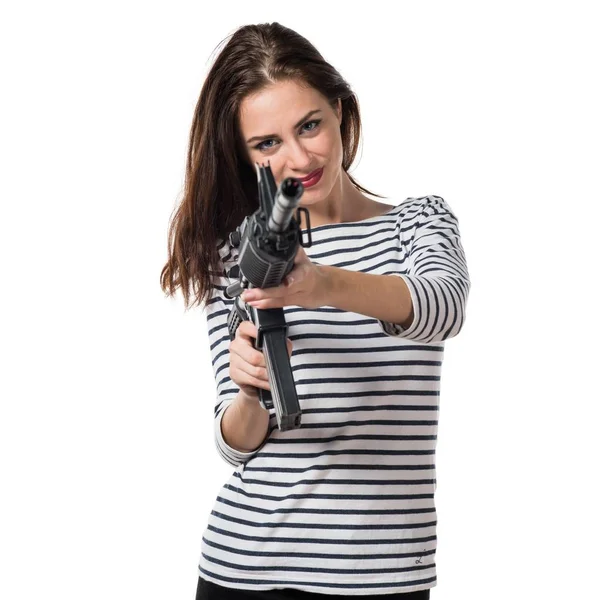 Jovencita bonita sosteniendo una pistola — Foto de Stock