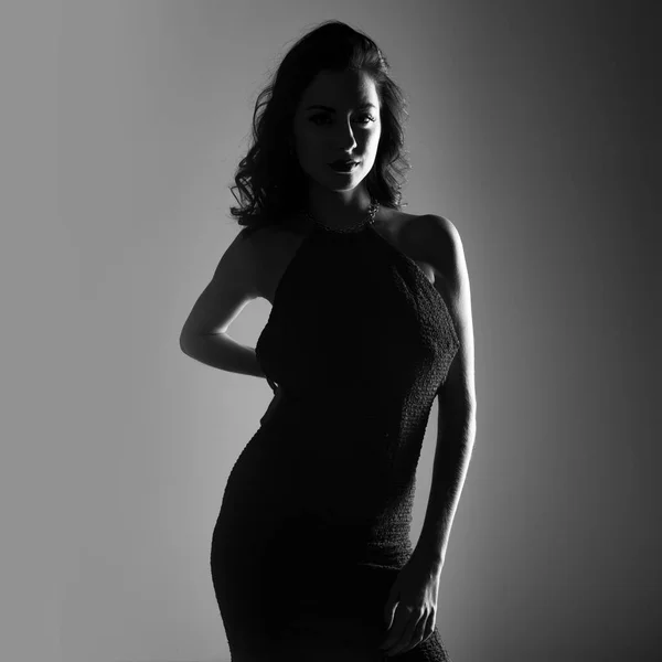 Brunette model woman posing in studio in black and white — Stock Photo, Image