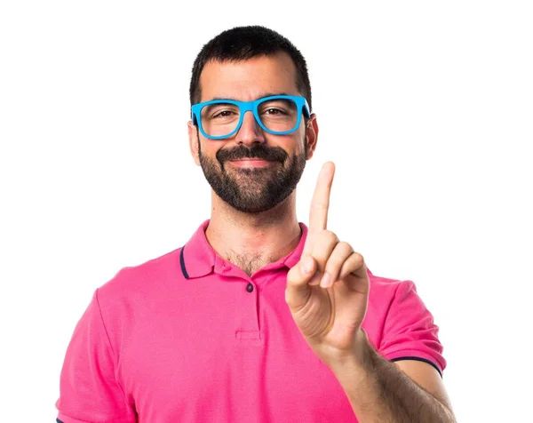 Uomo con vestiti colorati contando uno — Foto Stock