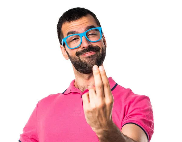 Man with colorful clothes coming gesture — Stock Photo, Image