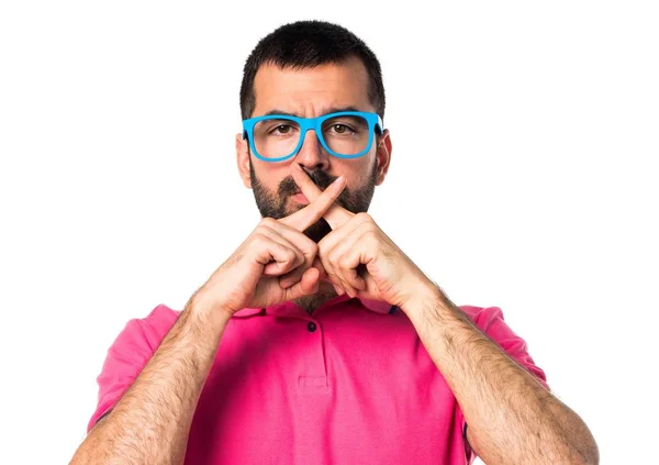 Man with colorful clothes making silence gesture — Stock Photo, Image