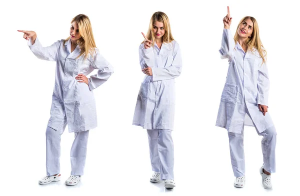 Doctor woman pointing up — Stock Photo, Image