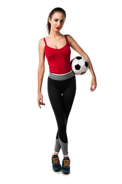 Mulher bonita esporte segurando uma bola de futebol — Fotografia de Stock