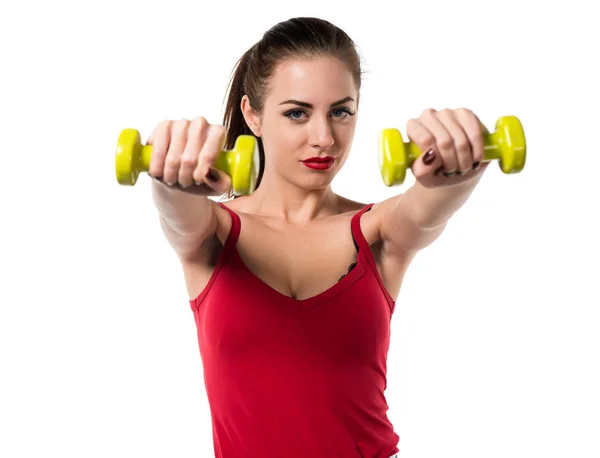 Mujer bastante deportiva haciendo levantamiento de pesas — Foto de Stock