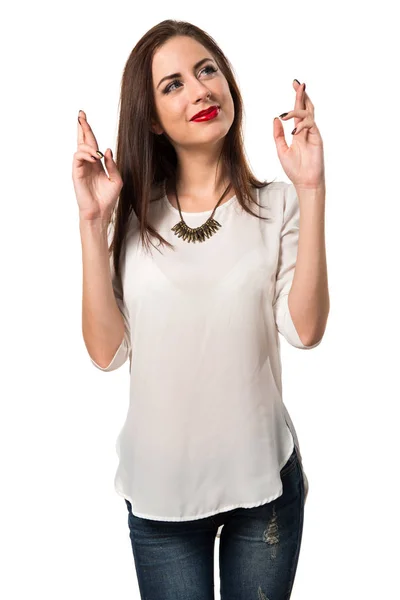 Pretty young girl with her fingers crossing — Stock Photo, Image