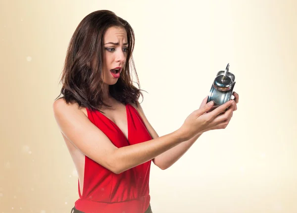 Pretty young girl holding vintage clock — Stock Photo, Image