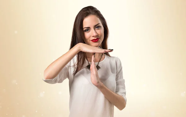 Pretty young girl making time out gesture — Stock Photo, Image