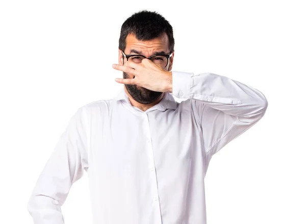 Hombre guapo con gafas haciendo mal gesto olor —  Fotos de Stock