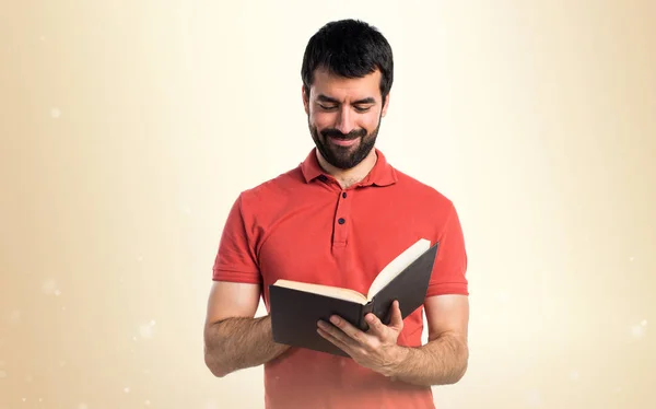 Handsome man reading book — Stock Photo, Image