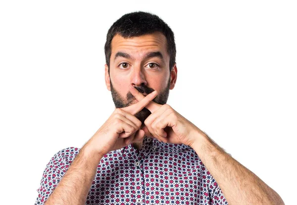 Pohledný muž dělat mlčení gesto — Stock fotografie