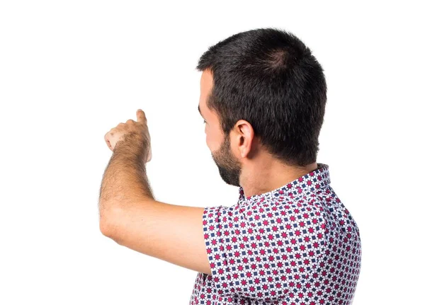 Handsome man pointing back — Stock Photo, Image