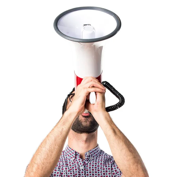 Man with glasses shouting by megaphone — Stock Photo, Image