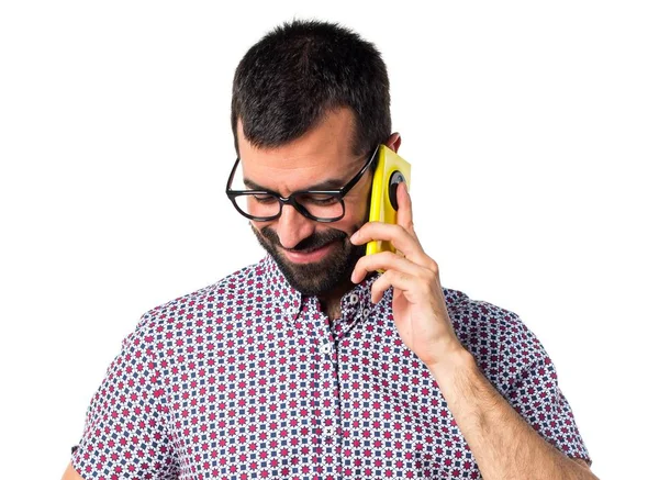 Man with glasses talking to mobile — Stock Photo, Image