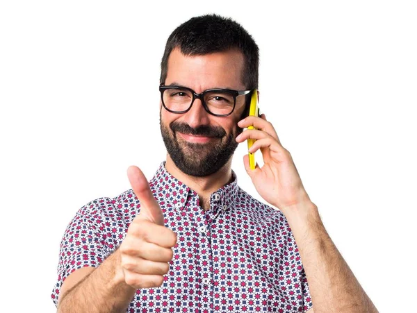 Man with glasses talking to mobile — Stock Photo, Image