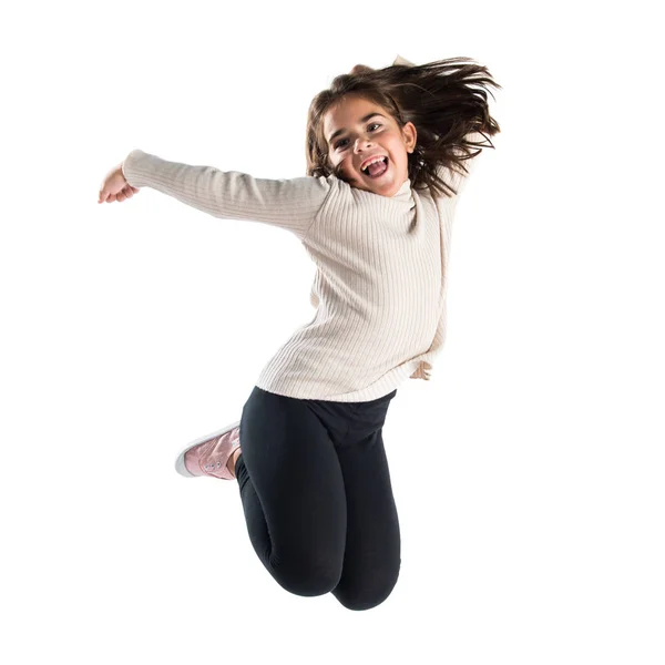 Piccola ragazza bruna che salta — Foto Stock