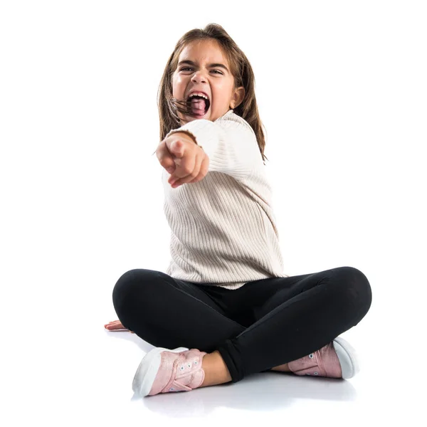 Little brunette girl pointing to the front — Stock Photo, Image