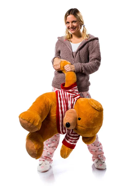 Pretty blonde girl in cute pajamas with big stuffed animal — Stock Photo, Image