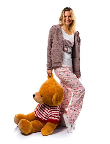 Pretty blonde girl in cute pajamas with big stuffed animal — Stock Photo, Image