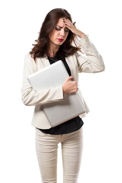 Frustrated pretty young business woman with laptop — Stock Photo, Image