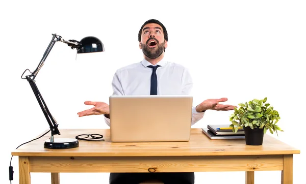 Businessman in his office pleading — Stock Photo, Image