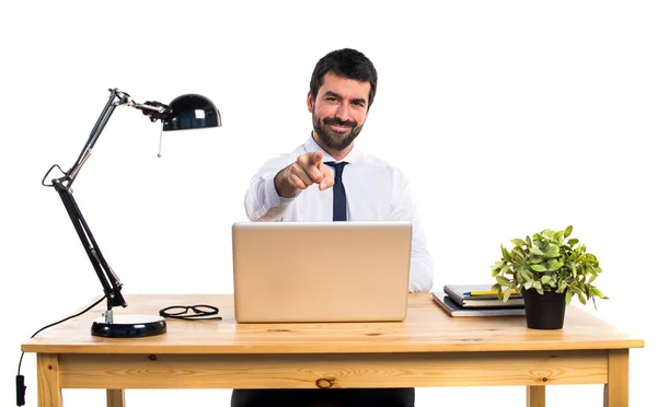 Businessman in his office pointing to the front — Stock Photo, Image