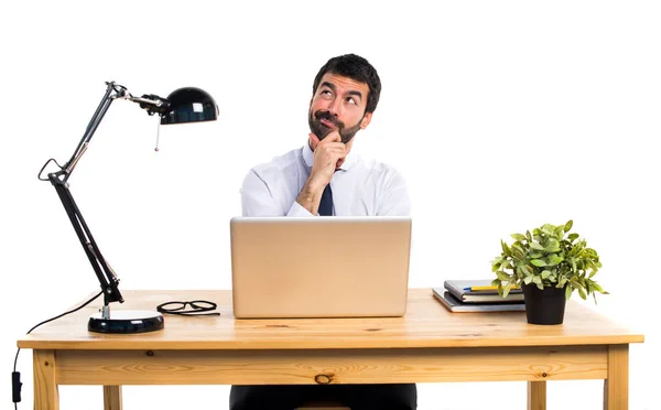 Businessman in his office thinking — Stock Photo, Image
