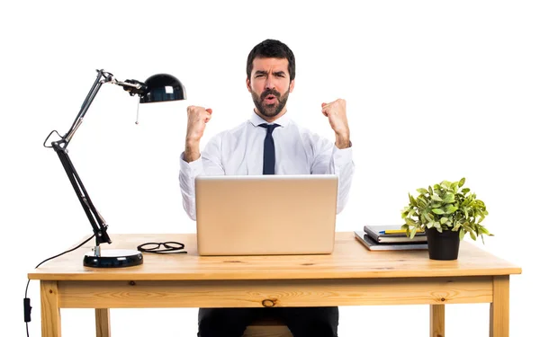 Lucky businessman in his office — Stock Photo, Image