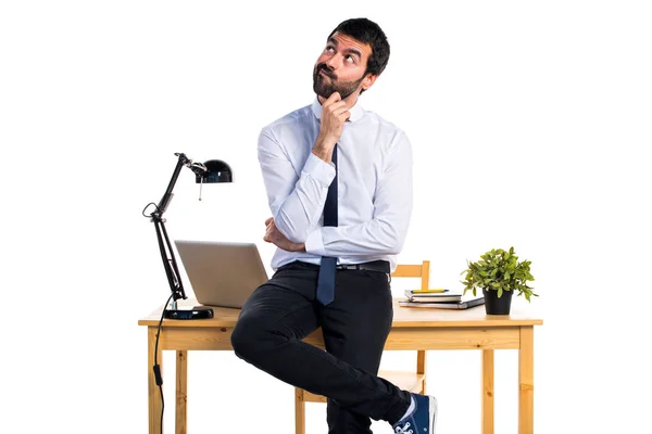 Businessman in his office thinking — Stock Photo, Image