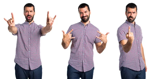 Hombre guapo haciendo gesto de cuerno —  Fotos de Stock