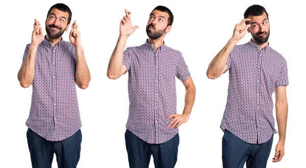 Homem bonito com os dedos cruzando — Fotografia de Stock