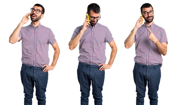 Man with glasses talking to mobile — Stock Photo, Image