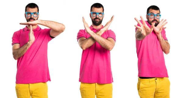 Man with colorful clothes doing NO gesture — Stock Photo, Image