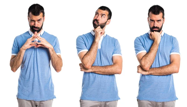 Man with blue shirt thinking — Stock Photo, Image