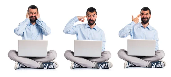 Hombre con portátil haciendo un gesto loco —  Fotos de Stock