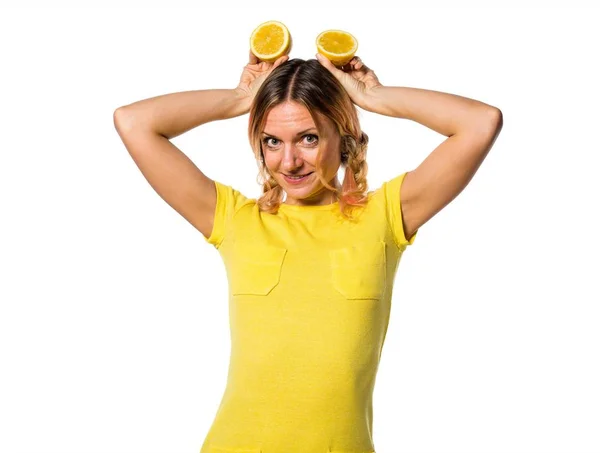 Beautiful blonde woman holding lemons — Stock Photo, Image