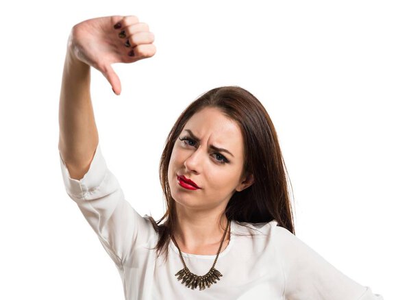 Pretty young girl making bad signal