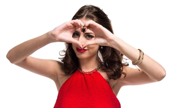 Pretty young girl making a heart with her hands — Stock Photo, Image