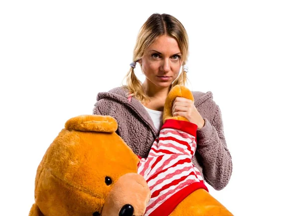 Pretty blonde girl in cute pajamas with big stuffed animal — Stock Photo, Image