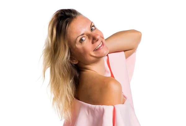 Pretty model woman posing in studio with a pink dress — Stock Photo, Image