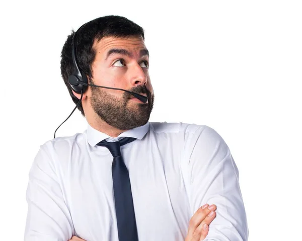 Young man with a headset making unimportant gesture — Stock Photo, Image