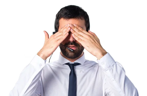 Young man with a headset covering his eyes — Stock Photo, Image