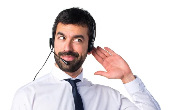 Handsome telemarketer man listening something — Stock Photo, Image