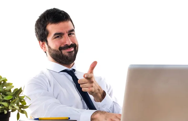 Handsome businessman in his office with thumb up — Stock Photo, Image