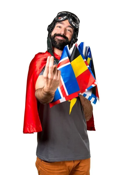 Superhéroe con un montón de banderas que vienen gesto —  Fotos de Stock