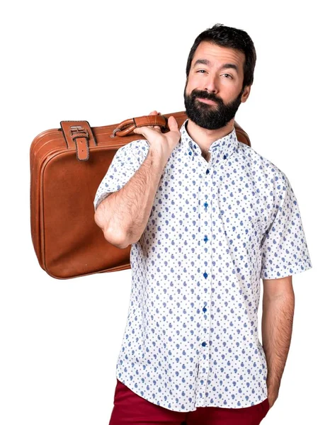 Knappe brunette man met baard die houden van een vintage koffer — Stockfoto