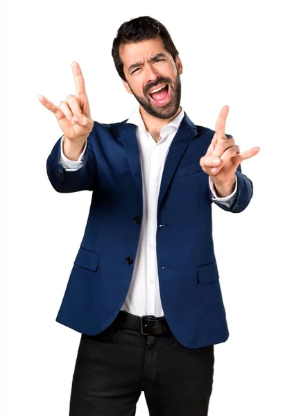 Hombre guapo haciendo gesto de cuerno —  Fotos de Stock