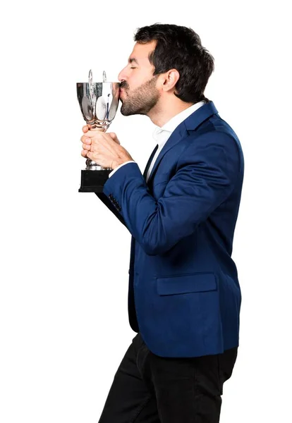 Hombre guapo sosteniendo un trofeo —  Fotos de Stock